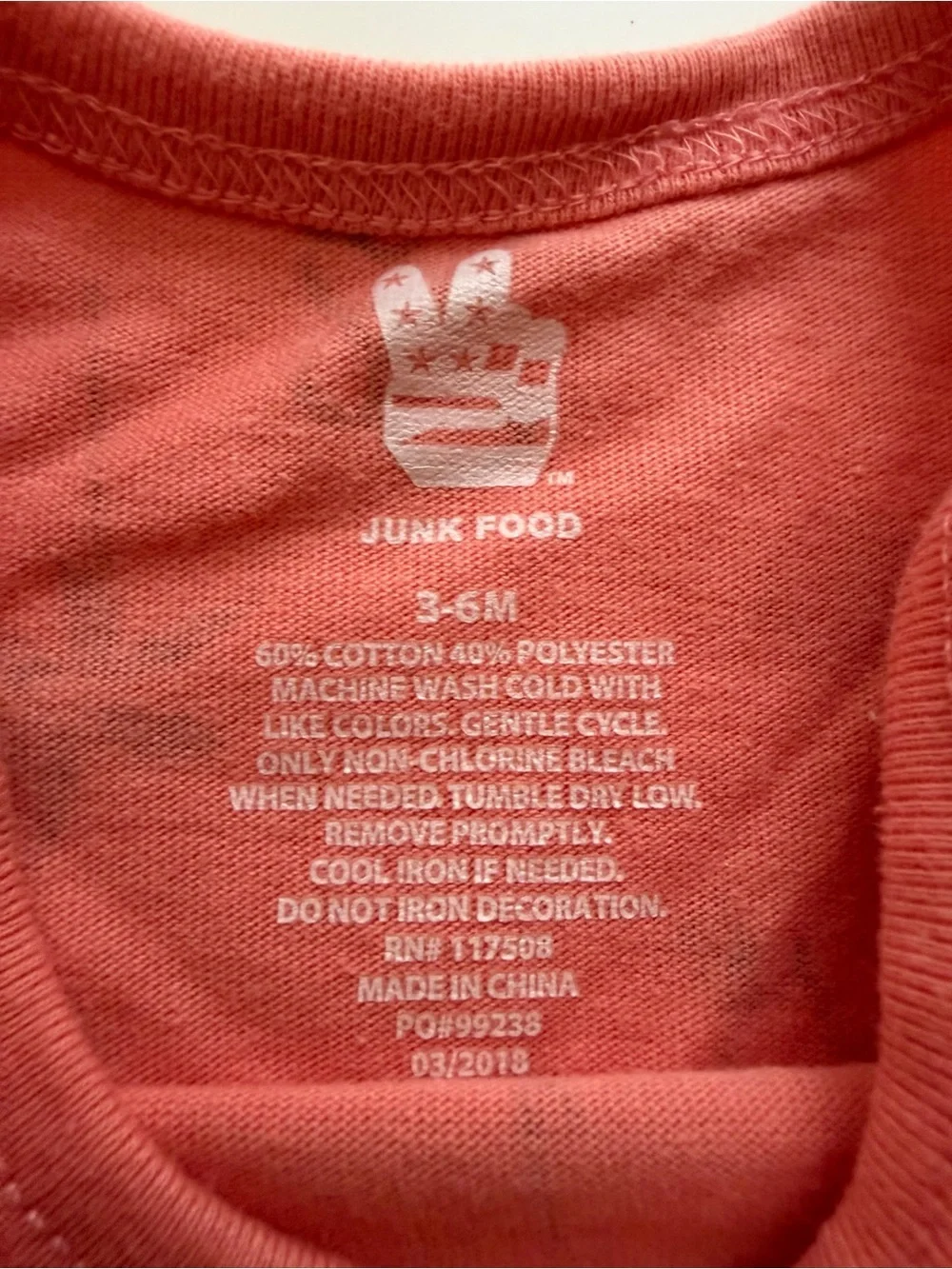 Junk Food Clothing Coral Pink Bodysuit with Navy Character Print